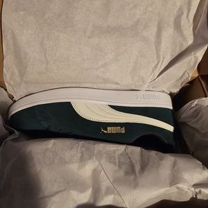 Brand new pumas a greenish teal.